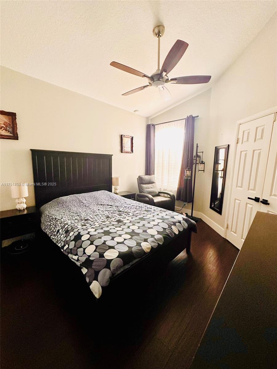 3961 Antigua Point Drive Boca Raton, FL 33487 - Photo 51 of 65 a bed sitting in a bedroom next to a window