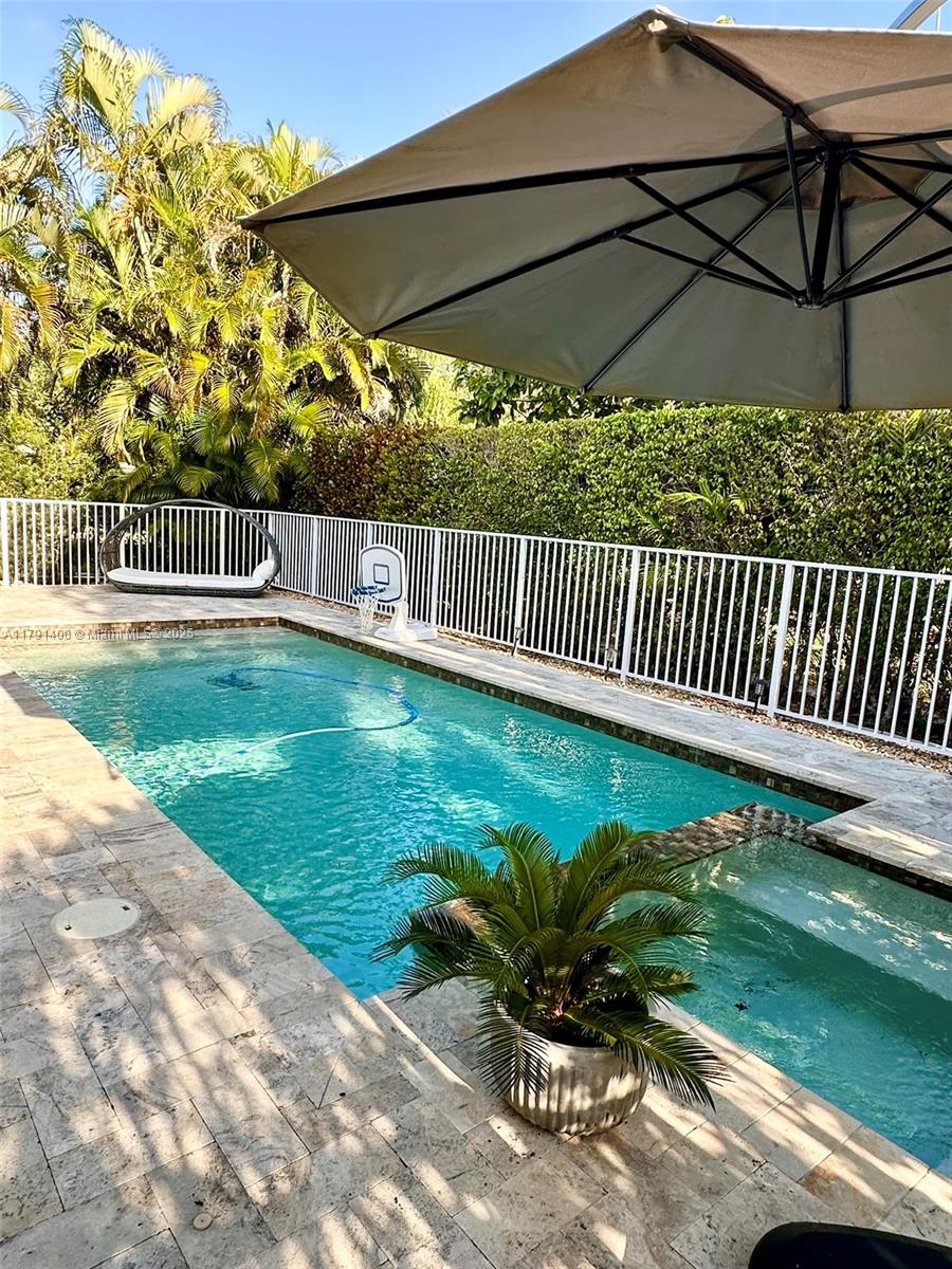 3961 Antigua Point Drive Boca Raton, FL 33487 - Photo 53 of 65 a view of a chair and table in the garden