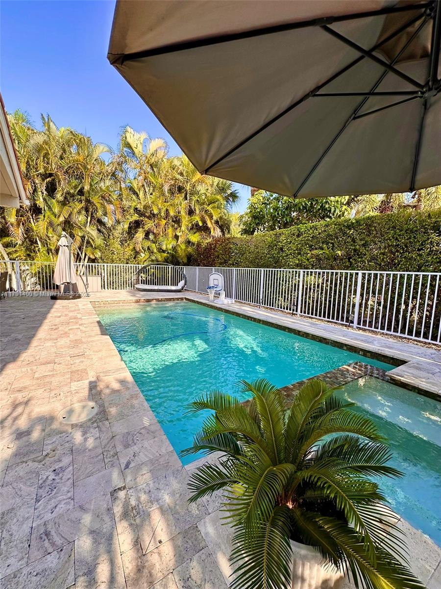 3961 Antigua Point Drive Boca Raton, FL 33487 - Photo 55 of 65 a view of a backyard with a garden