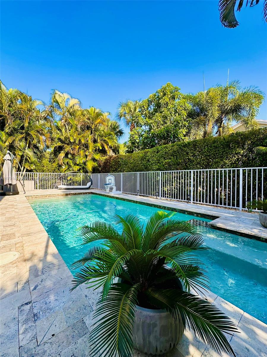 3961 Antigua Point Drive Boca Raton, FL 33487 - Photo 59 of 65 a view of a garden with a chair