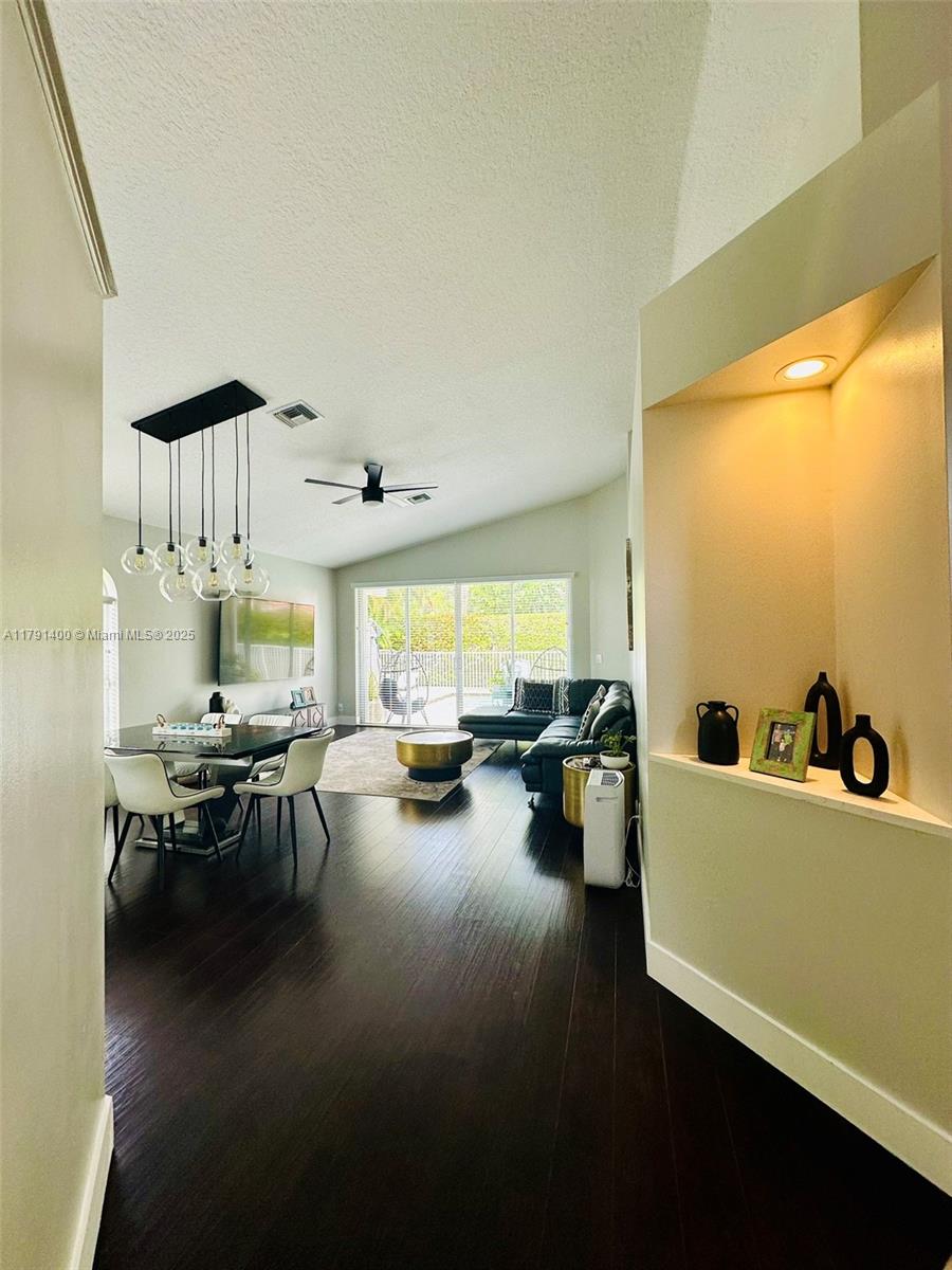 3961 Antigua Point Drive Boca Raton, FL 33487 - Photo 6 of 65 a living room with furniture and a table