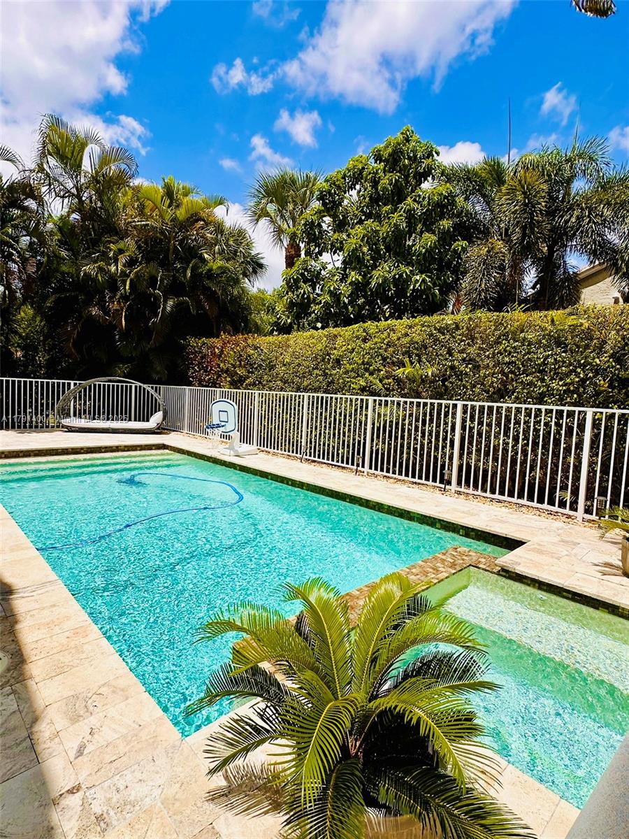 3961 Antigua Point Drive Boca Raton, FL 33487 - Photo 61 of 65 a view of a garden with wooden fence