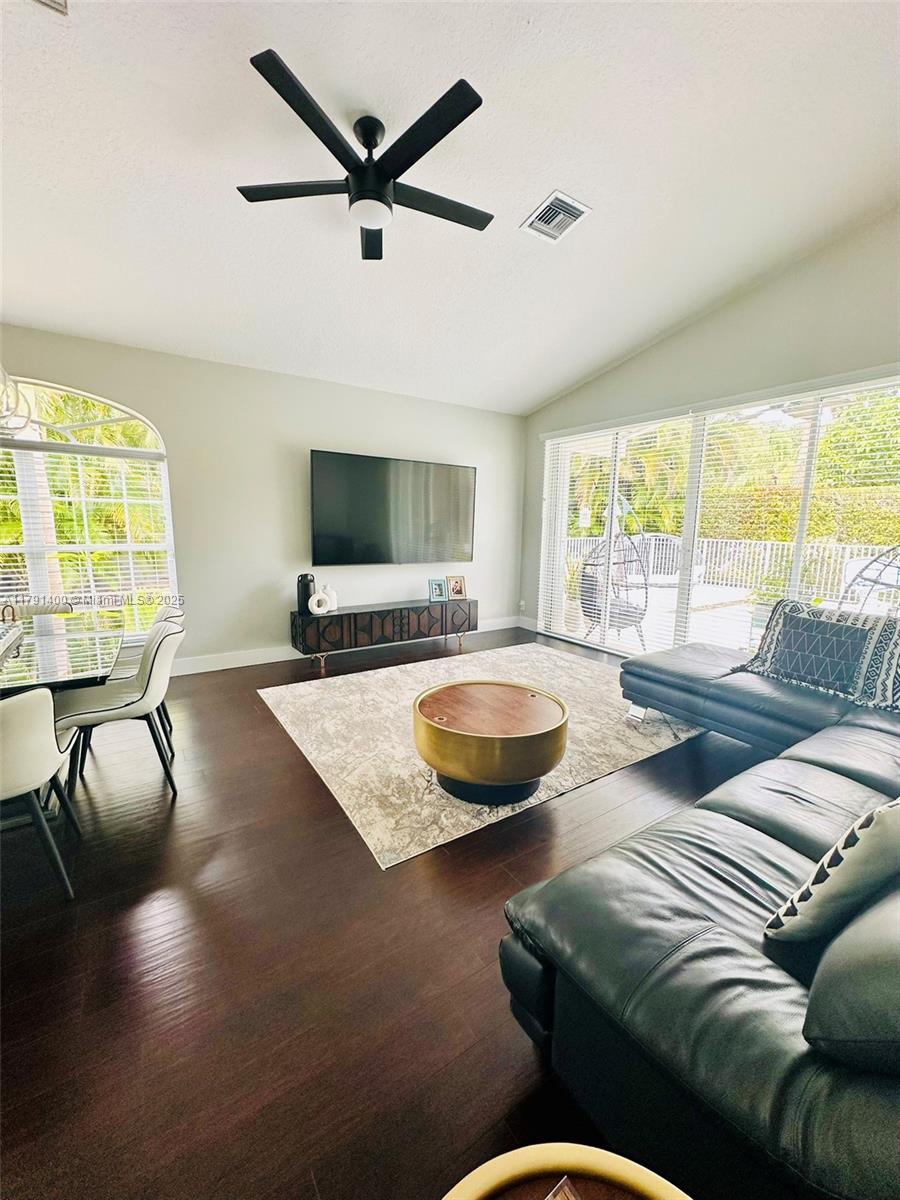 3961 Antigua Point Drive Boca Raton, FL 33487 - Photo 10 of 65 a living room with furniture and a large window