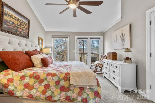 a bedroom with a large bed and a window