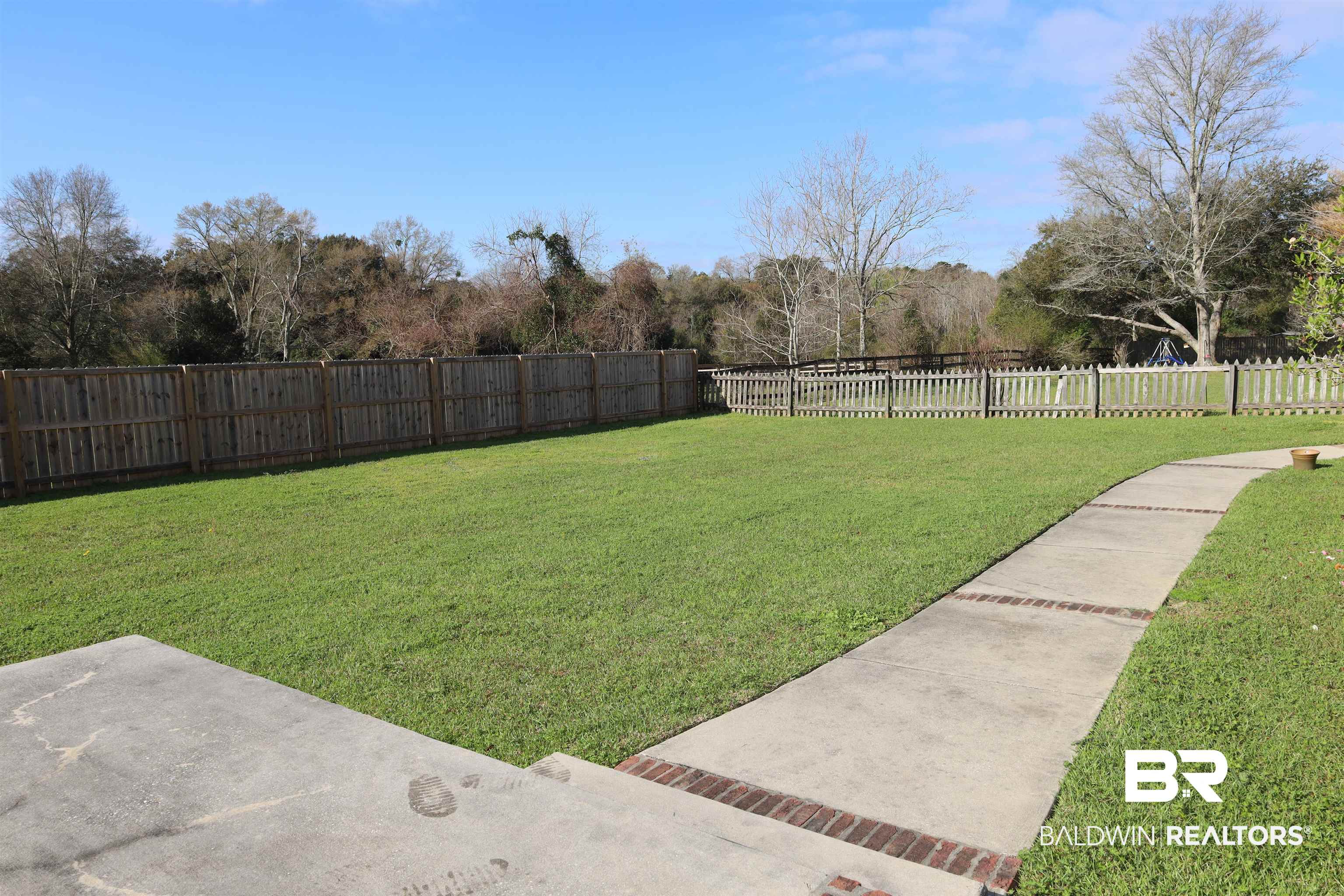 111 Destrehan Road Fairhope, AL 36532 - Photo 28 of 29 View of yard with a fenced backyard