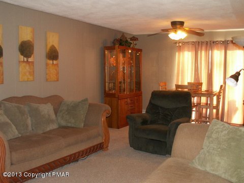 1138 Clover Road Long Pond, PA 18334 - Photo 15 of 23 a living room with furniture and a large window