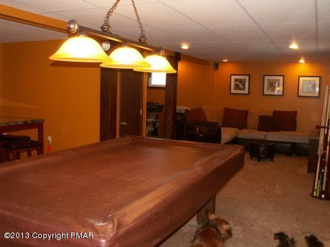 1138 Clover Road Long Pond, PA 18334 - Photo 17 of 23 a room with furniture and a chandelier