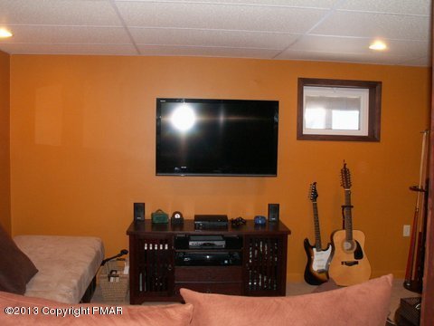1138 Clover Road Long Pond, PA 18334 - Photo 20 of 23 a living room with furniture and a flat screen tv