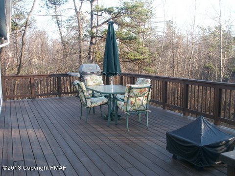 1138 Clover Road Long Pond, PA 18334 - Photo 22 of 23 a view of a chairs and table on the wooden floor