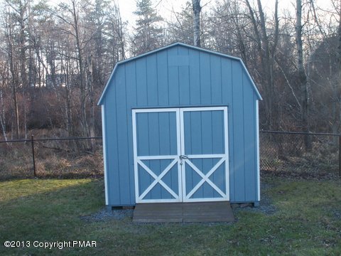 1138 Clover Road Long Pond, PA 18334 - Photo 23 of 23 a wooden door in front of a house