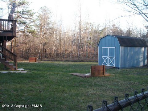 1138 Clover Road Long Pond, PA 18334 - Photo 3 of 23 a backyard of a house with lots of green space
