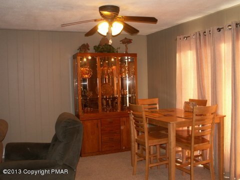 1138 Clover Road Long Pond, PA 18334 - Photo 5 of 23 a view of a dining room with furniture and chandelier