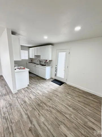 a view of a kitchen with wooden floor