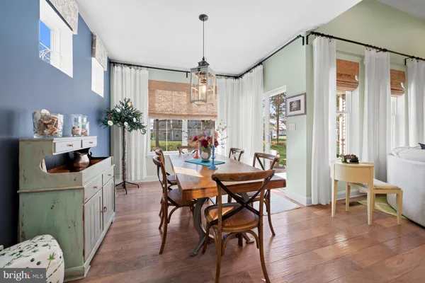 a kitchen with a sink appliances and cabinets