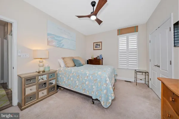 a bedroom with a bed and a dresser