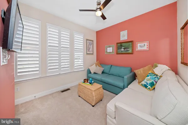 a bed room with a bed and a chair