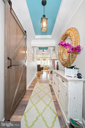 a view of entryway with kitchen and windows