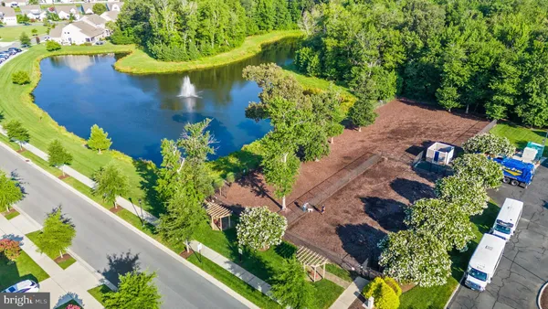 an aerial view of a house with a yard and garden