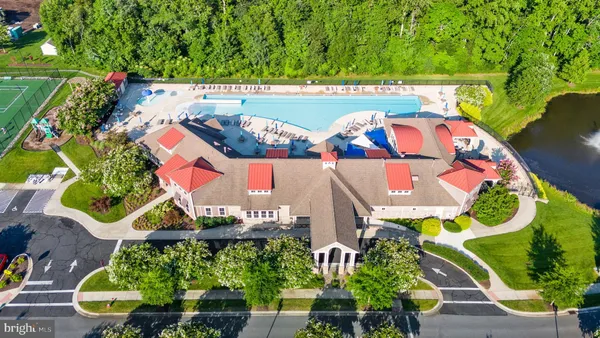 an outdoor space with furniture and umbrella