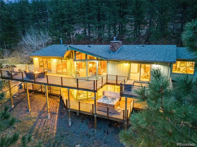 swimming pool view from a balcony with outdoor seating
