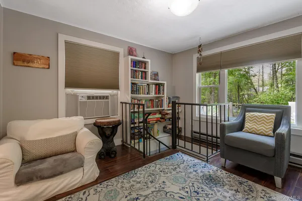 a bedroom with furniture and a window