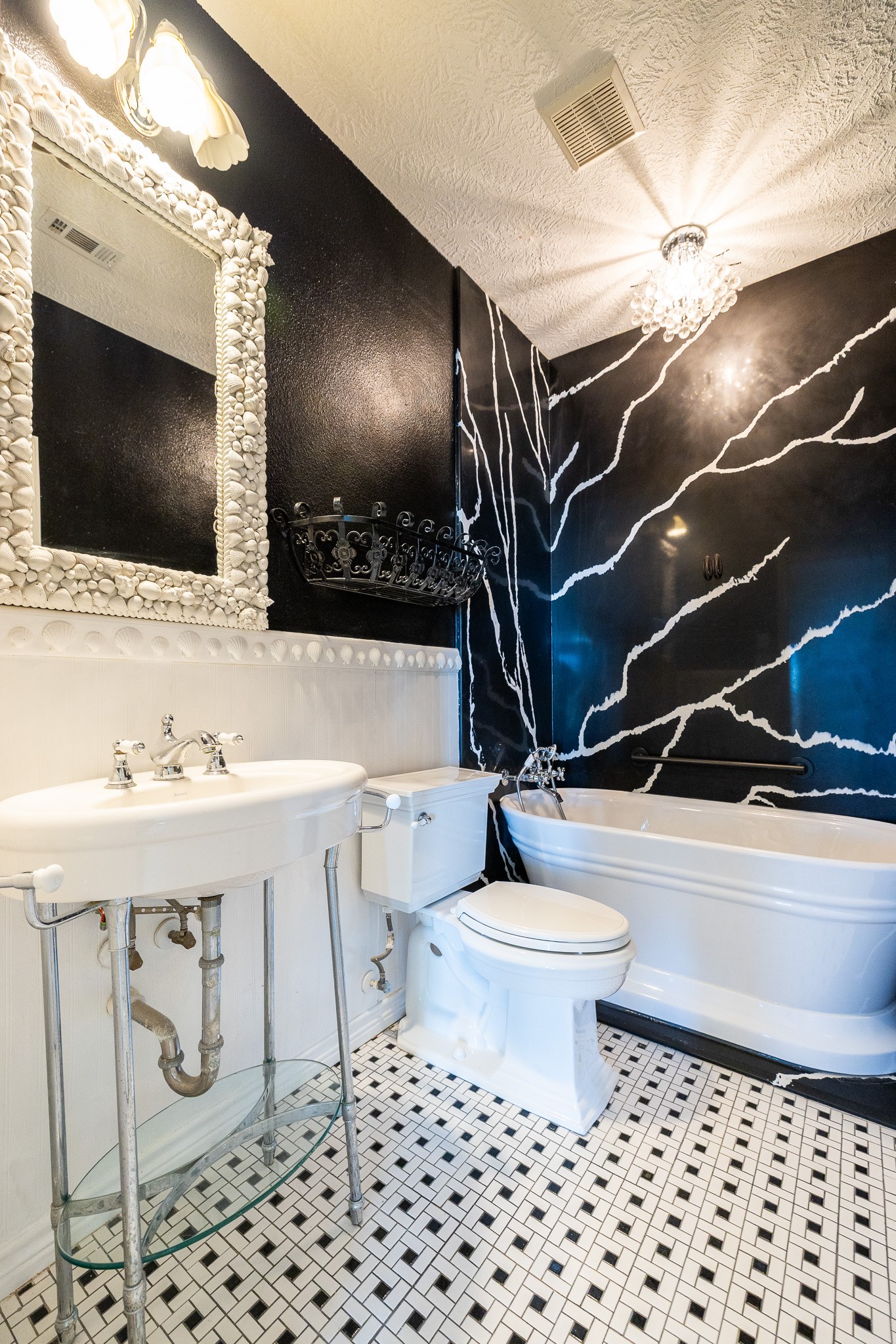 1991 Gulf Crystal Beach, TX 77650 - Photo 7 of 20 a bathroom with a sink a toilet and a mirror