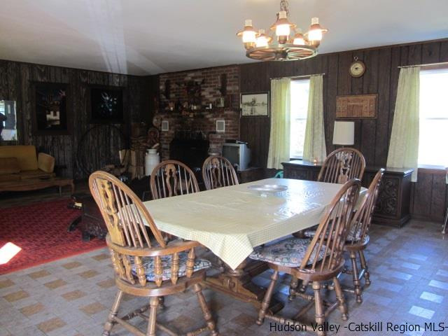 76 Tamarack Road Greenfield Park, NY 12435 - Photo 6 of 13 a view of a dining room with furniture window and wooden floor