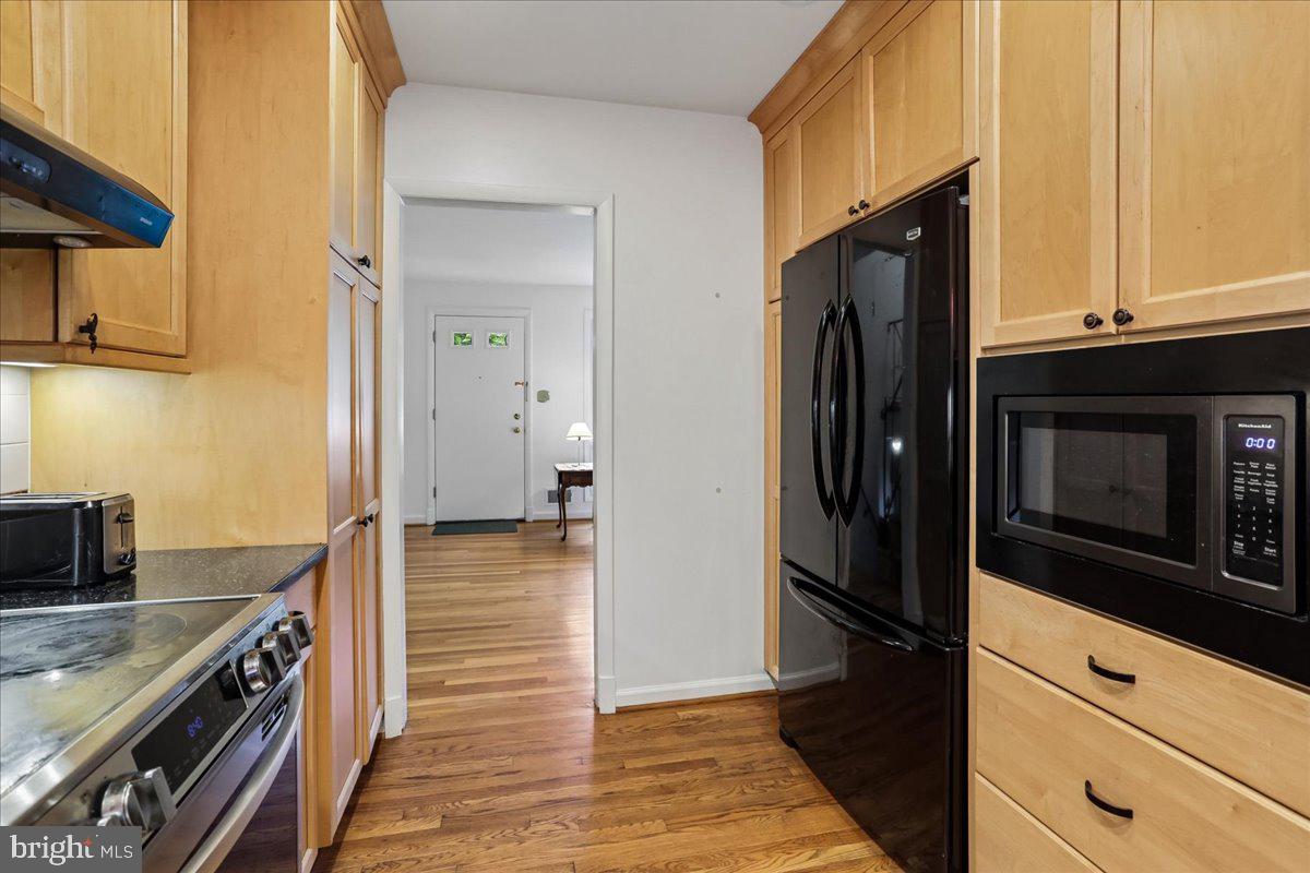 1703 Tilton Drive Silver Spring, MD 20902 - Photo 12 of 39 Modern kitchen with warm wood tones.