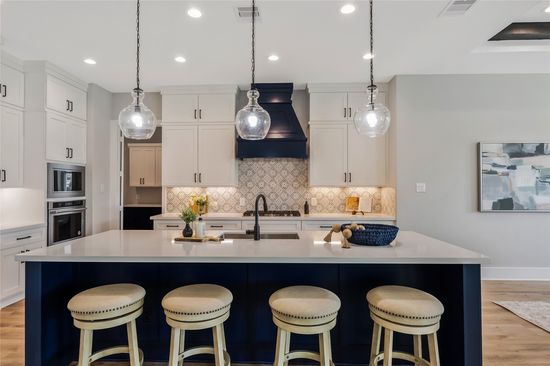1404 Bluebonnet Ridge Drive Chappell Hill, TX 77426 - Photo 16 of 49 Spacious kitchen island with ample seating, perfect for gatherings.