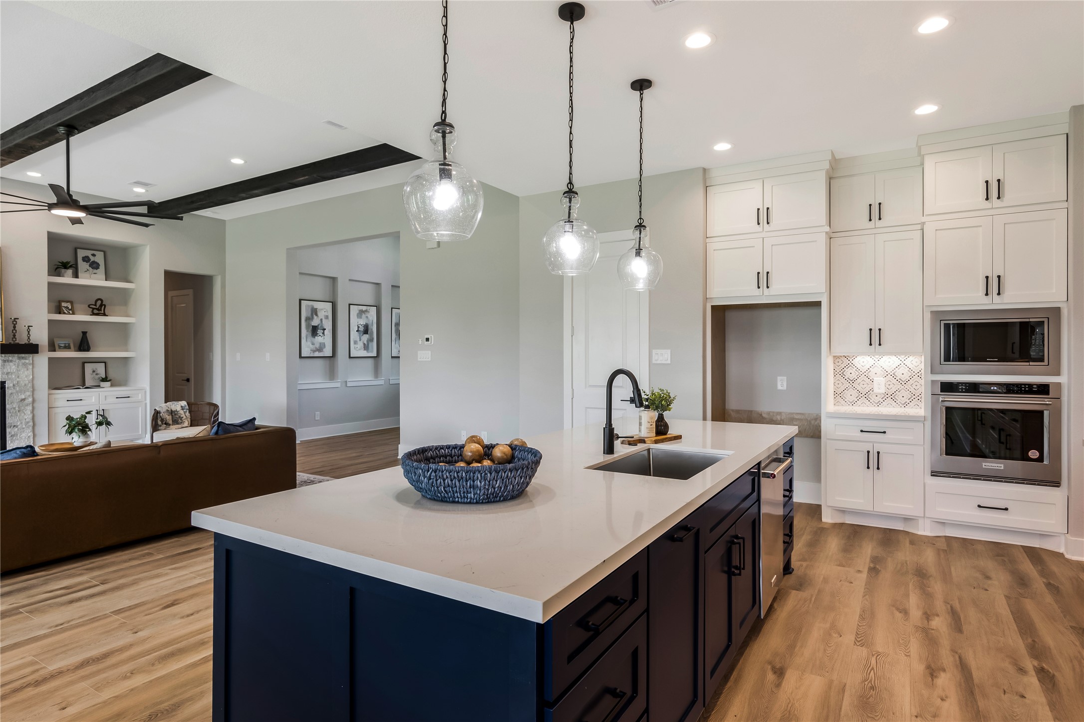 1404 Bluebonnet Ridge Drive Chappell Hill, TX 77426 - Photo 19 of 49 Stunning kitchen with modern fixtures, elegant cabinetry, and a spacious island, perfect for cooking and entertaining.