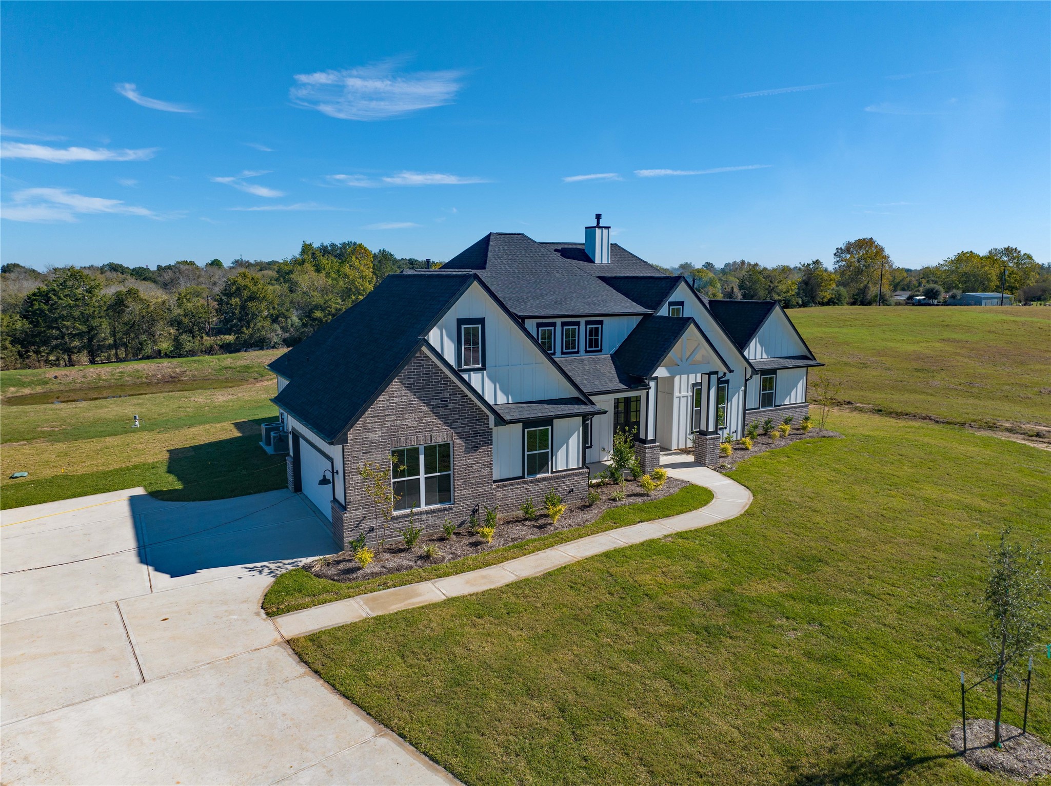 1404 Bluebonnet Ridge Drive Chappell Hill, TX 77426 - Photo 5 of 49 Charming home with backyard pond views.