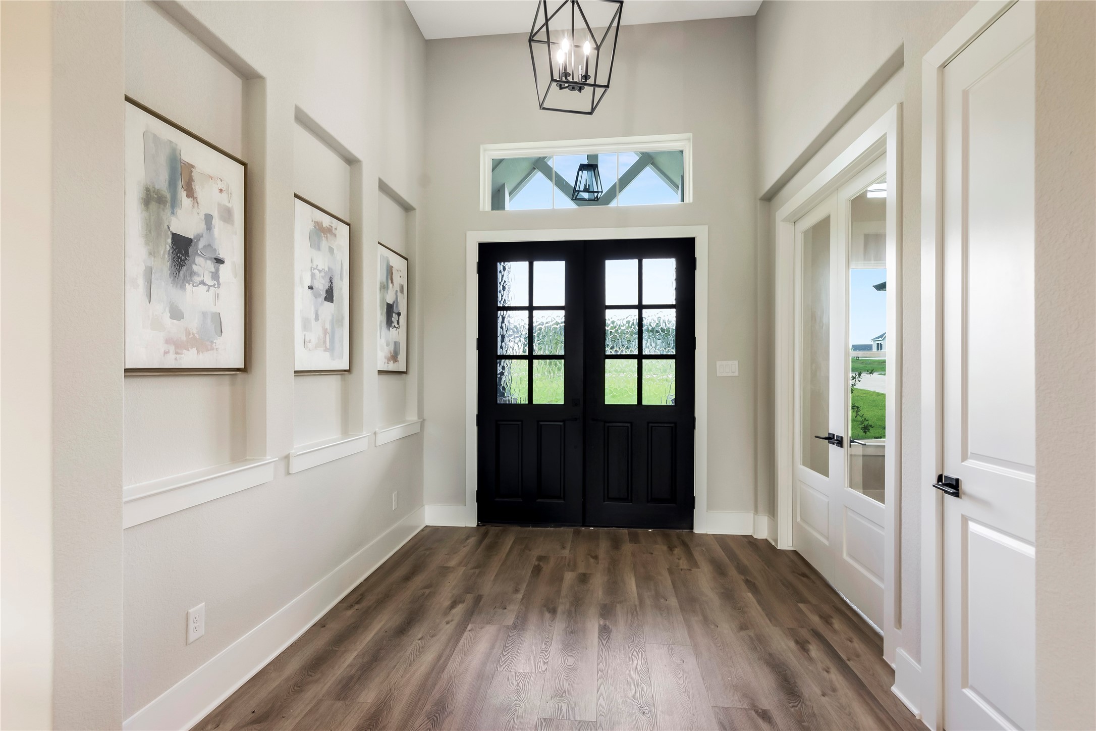 1404 Bluebonnet Ridge Drive Chappell Hill, TX 77426 - Photo 8 of 49 Elegant foyer with stylish double doors creating a welcoming entrance.