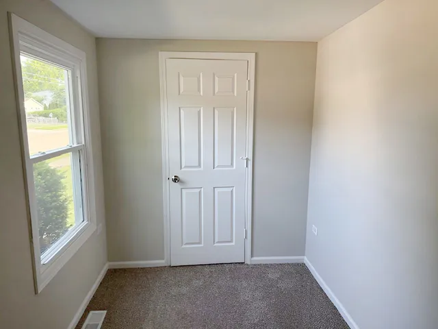 a view of an empty room with window