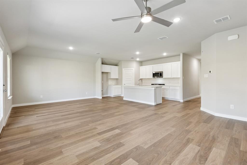 1417 Barbacoa Drive Haslet, TX 76052 - Photo 32 of 32 a view of kitchen with wooden floor and window