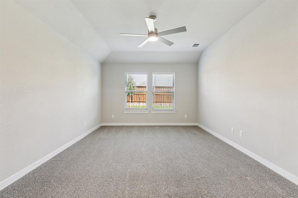 1417 Barbacoa Drive Haslet, TX 76052 - Photo 14 of 32 an empty room with a window and a ceiling fan