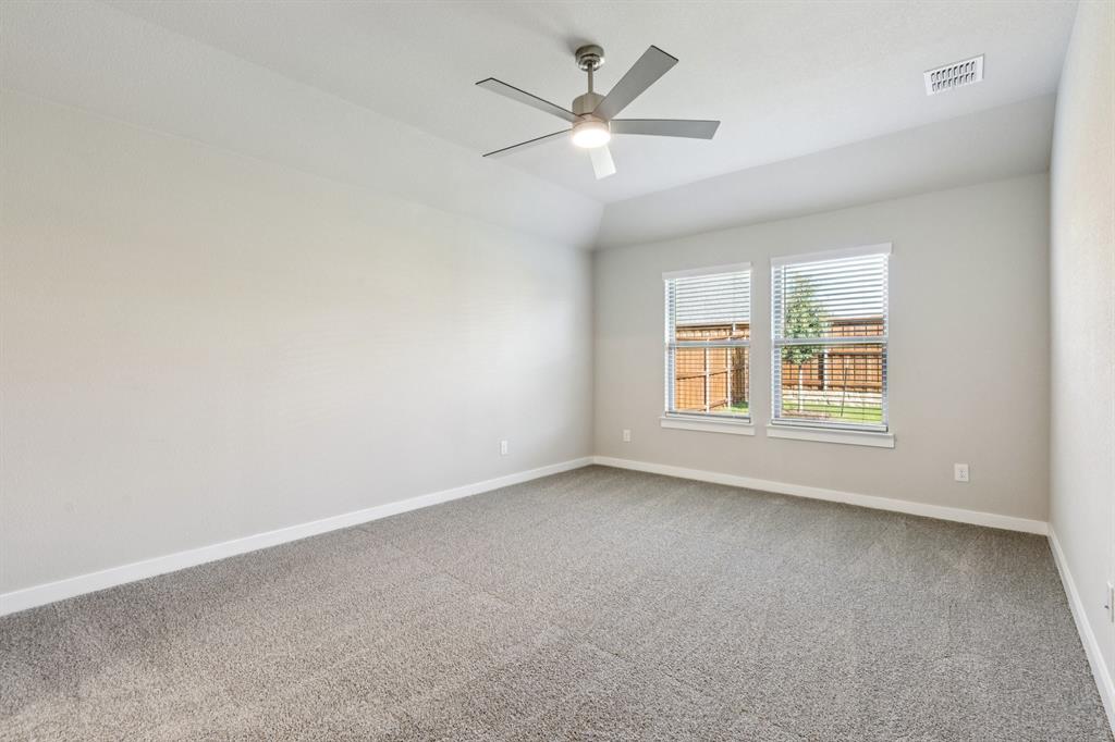 1417 Barbacoa Drive Haslet, TX 76052 - Photo 15 of 32 an empty room with a window and a ceiling fan