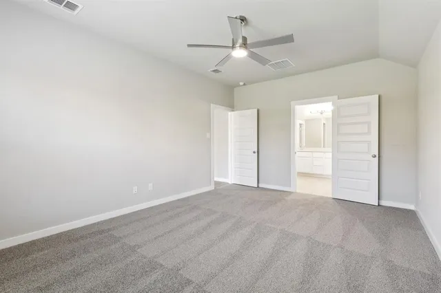 a bed room with a bed and a television