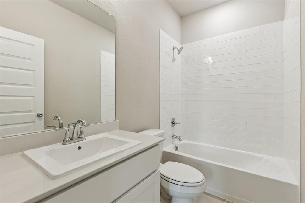 1417 Barbacoa Drive Haslet, TX 76052 - Photo 23 of 32 a bathroom with a sink a toilet and a bathtub