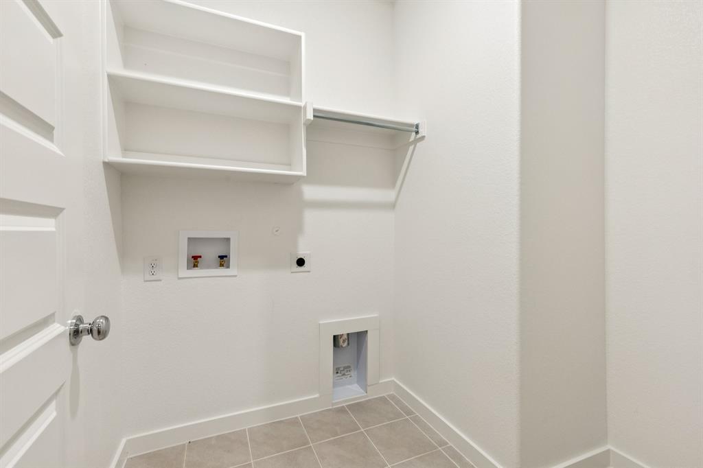 1417 Barbacoa Drive Haslet, TX 76052 - Photo 24 of 32 a view of small space with racks on the wall