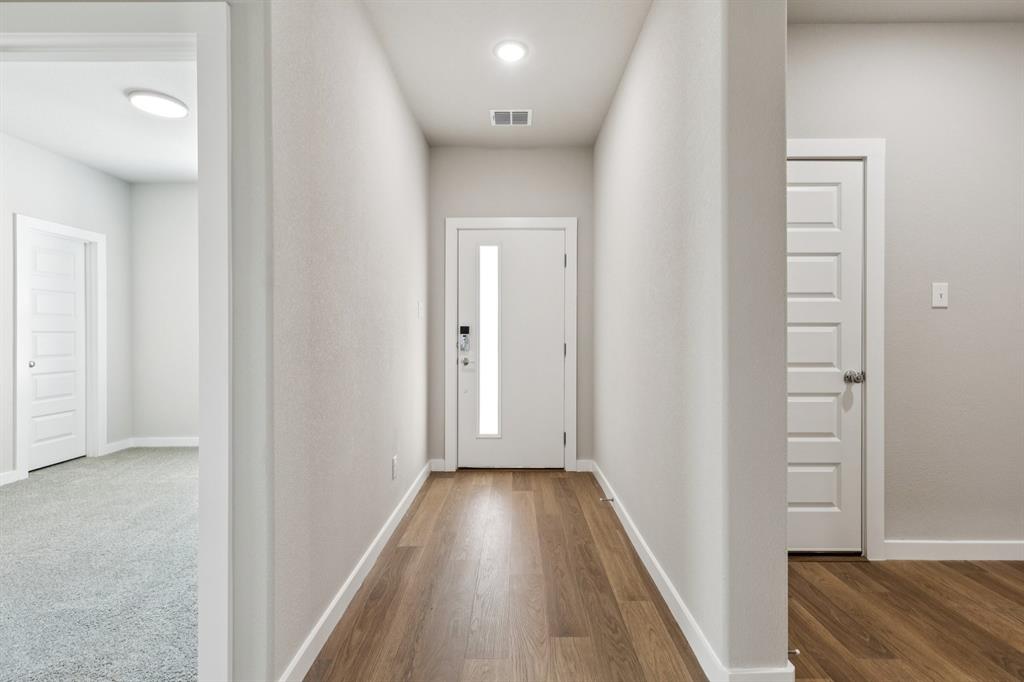 1417 Barbacoa Drive Haslet, TX 76052 - Photo 26 of 32 a view of hallway with wooden floor