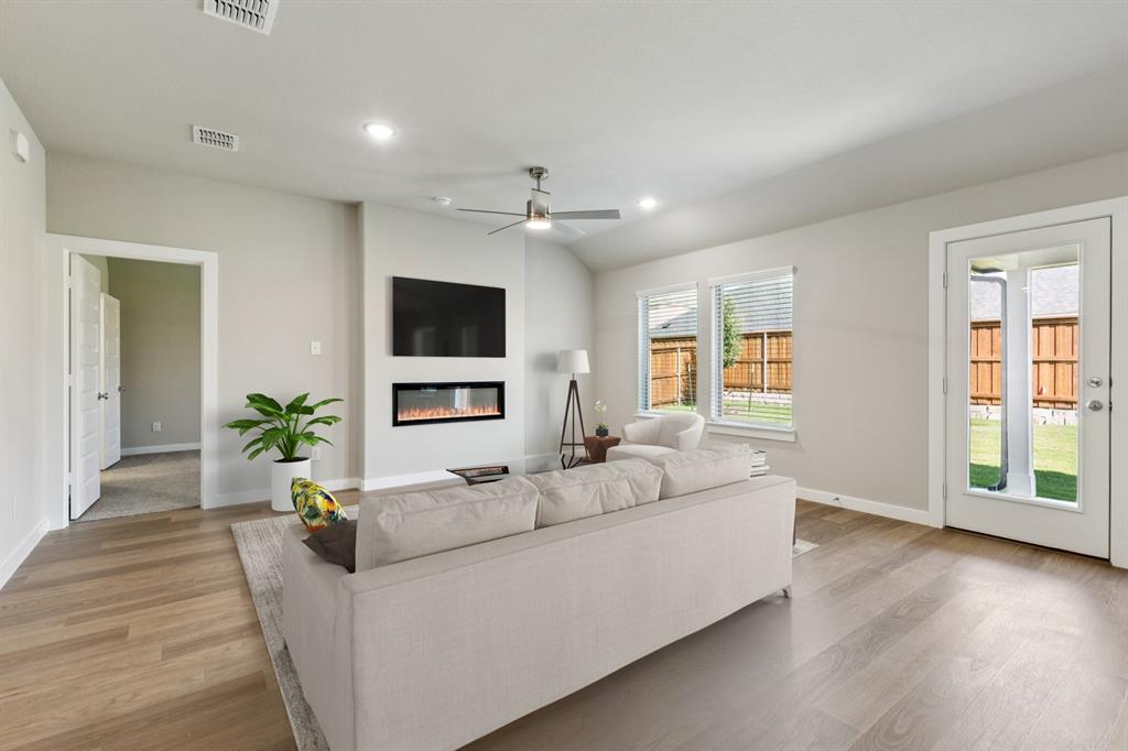 1417 Barbacoa Drive Haslet, TX 76052 - Photo 10 of 32 a living room with furniture and a flat screen tv