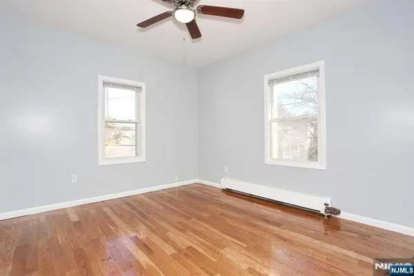 a bathroom with a sink toilet a mirror and shower