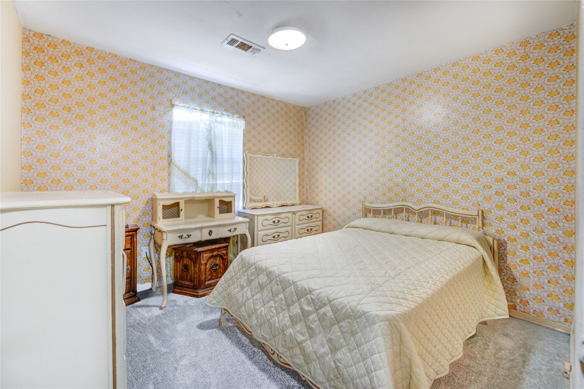 5223 Grace Point Lane Houston, TX 77048 - Photo 12 of 24 a spacious bedroom with a bed and a stove top oven