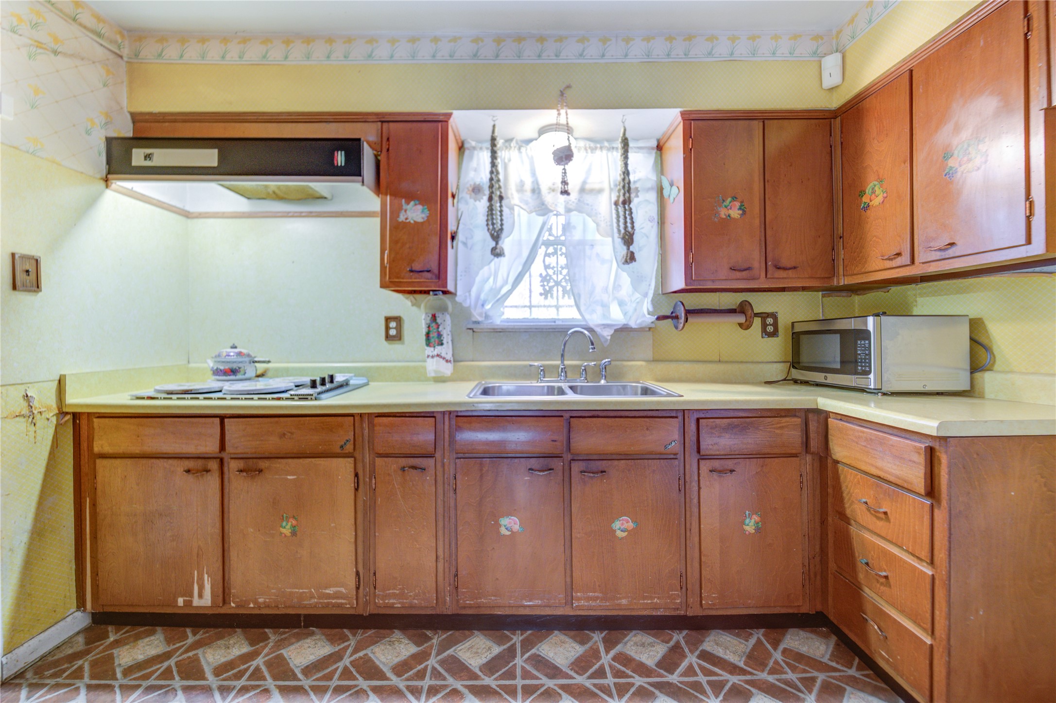 5223 Grace Point Lane Houston, TX 77048 - Photo 15 of 24 a kitchen with a sink and cabinets
