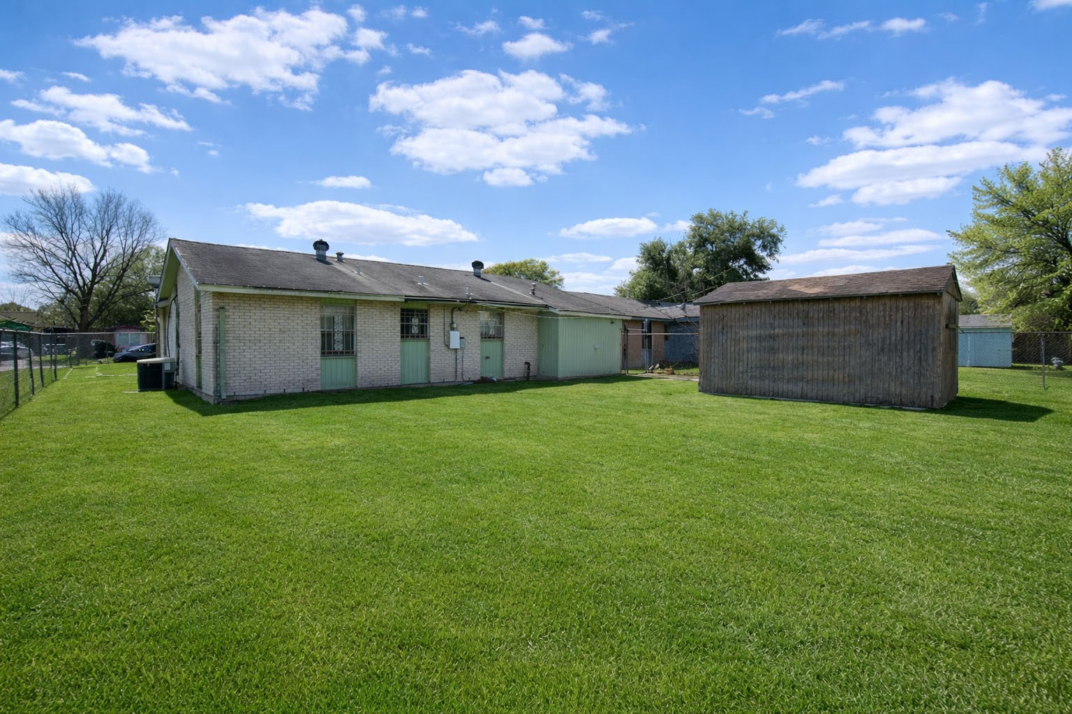 5223 Grace Point Lane Houston, TX 77048 - Photo 20 of 24 a view of a backyard with a garden and tree