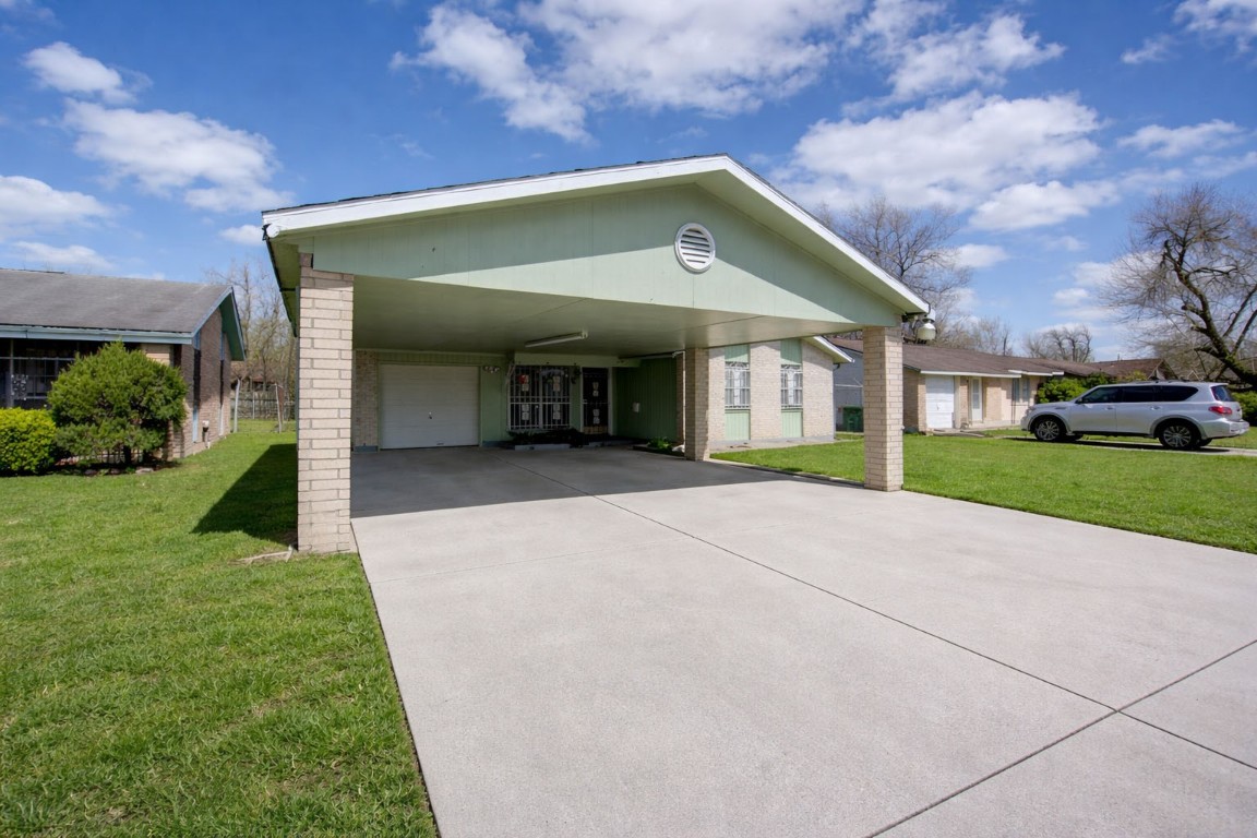 5223 Grace Point Lane Houston, TX 77048 - Photo 3 of 24 a view of a house with a yard