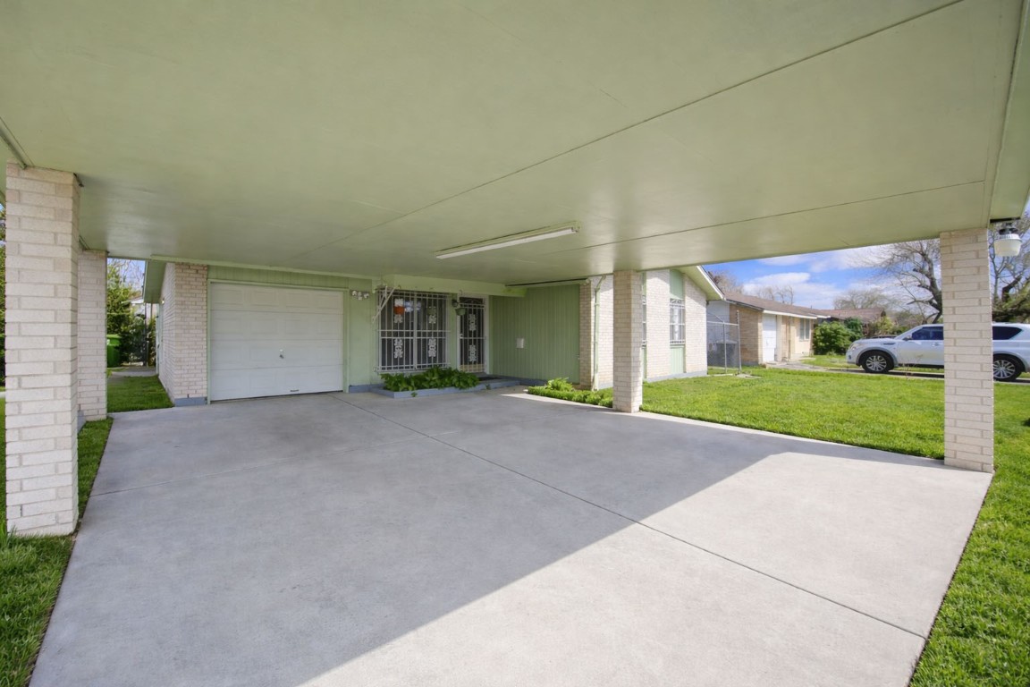 5223 Grace Point Lane Houston, TX 77048 - Photo 5 of 24 a view of a house with a yard and garage