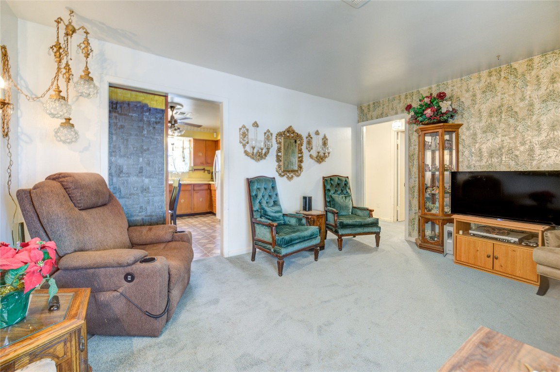 5223 Grace Point Lane Houston, TX 77048 - Photo 7 of 24 a living room with furniture and a flat screen tv