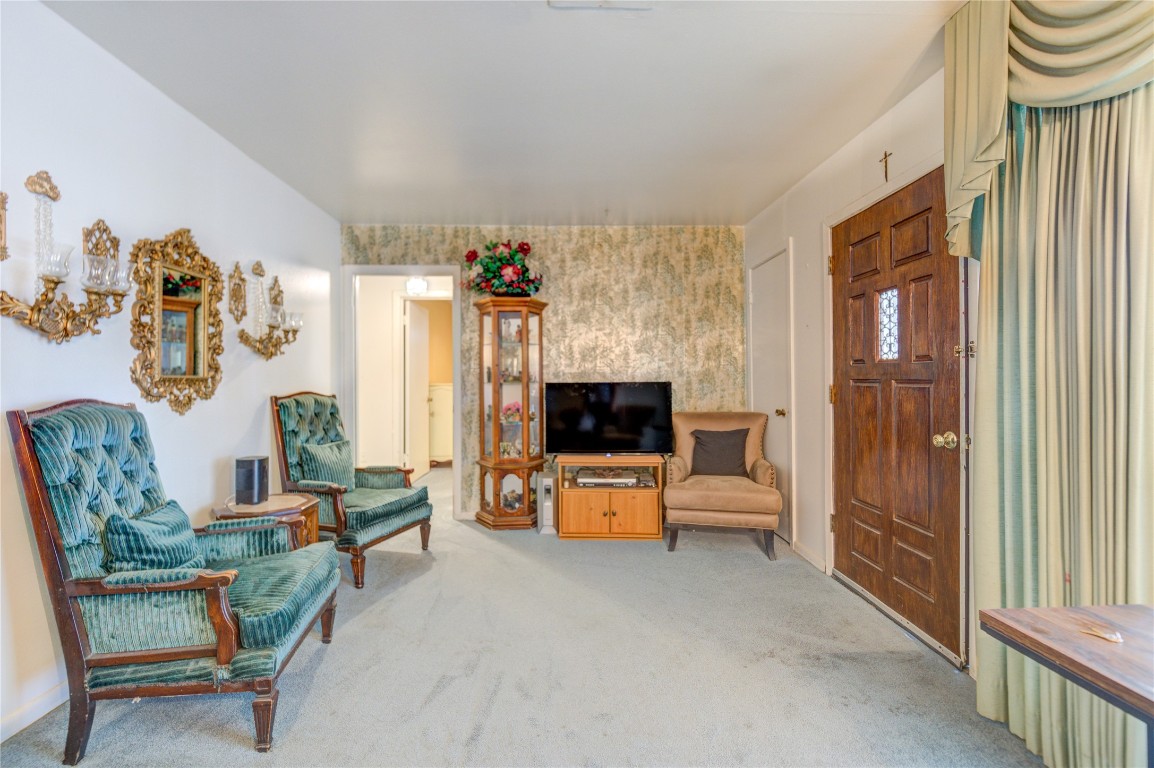 5223 Grace Point Lane Houston, TX 77048 - Photo 8 of 24 a living room with furniture and a flat screen tv