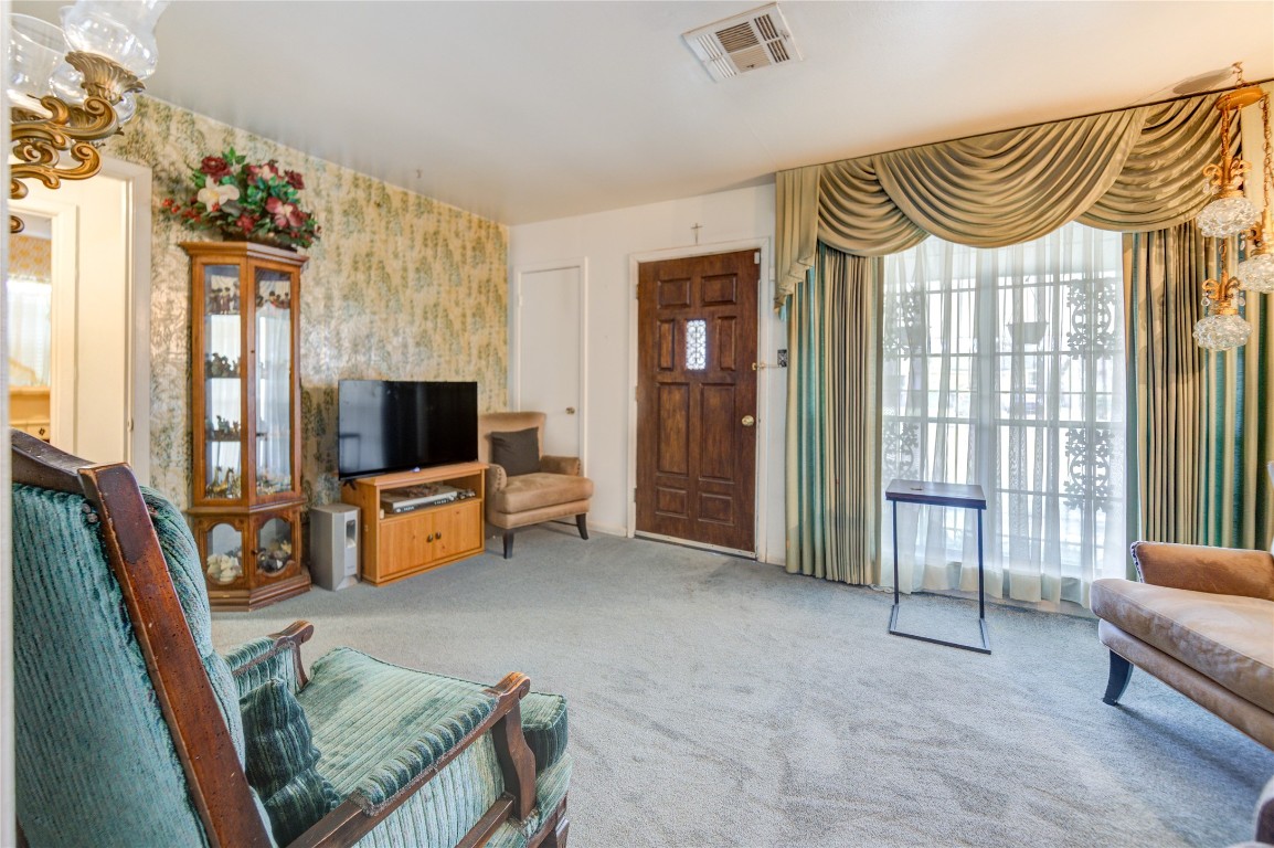 5223 Grace Point Lane Houston, TX 77048 - Photo 9 of 24 a bedroom with furniture and a flat screen tv